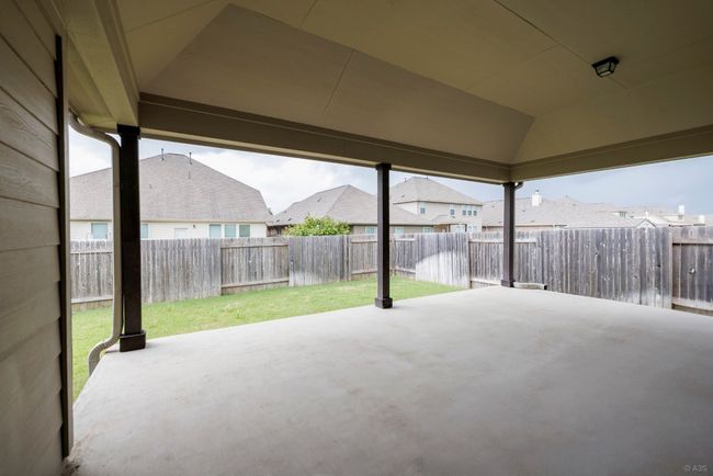 Fenced backyard with a patio and a residential view | Image 30