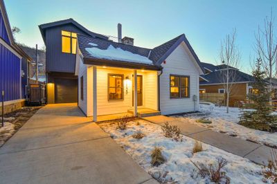 Modern farmhouse featuring covered porch and a garage | Image 2