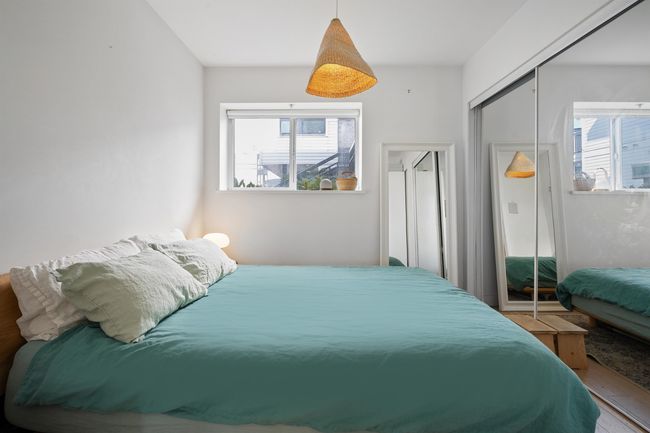Bedroom featuring a closet and wood finished floors | Image 15