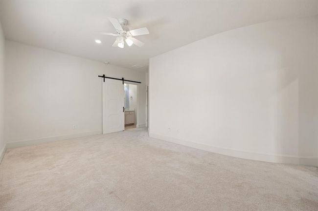 This bedroom is generously sized with a hidden Trendmaker room that is large enough to put in a study, exercise space, nursery, or anything else that you can imagine. | Image 34