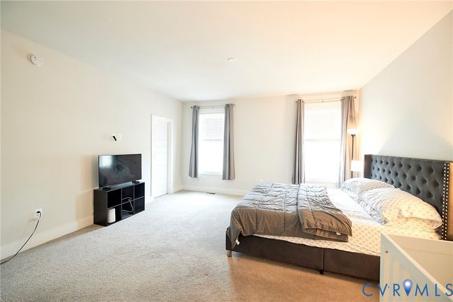 Bedroom featuring carpet floors and baseboards | Image 10