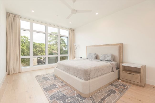 Primary Bedroom with electric shades. | Image 12