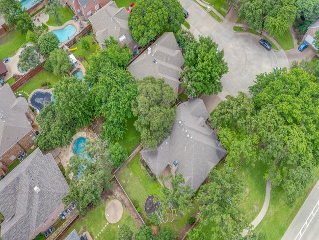 563 Austin Place is located at the end of the cul-de-sac. The property faces south and sides a common area that the neighborhood of 35 homes maintain. | Image 36