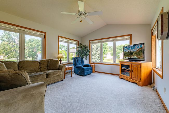 Lots of windows in the main floor family room provides plenty of natural light. | Image 9