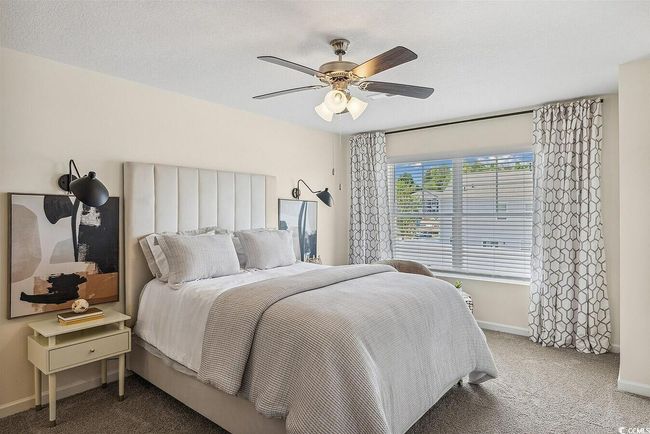 Bedroom featuring carpet floors and a ceiling fan | Image 22