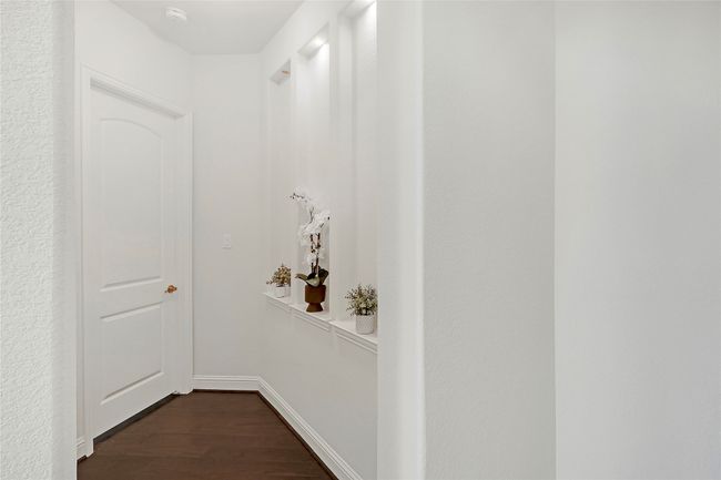 Hall with dark wood-style flooring and baseboards | Image 29