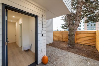 Private, full-fenced patio area next to front entry. | Image 3