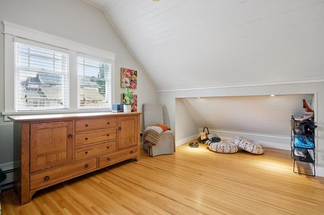 Interior space featuring baseboards, lofted ceiling, and light wood-style floors | Image 23
