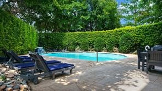 This is the Second Swimming pool with a Patio in a Courtyard Setting | Image 16
