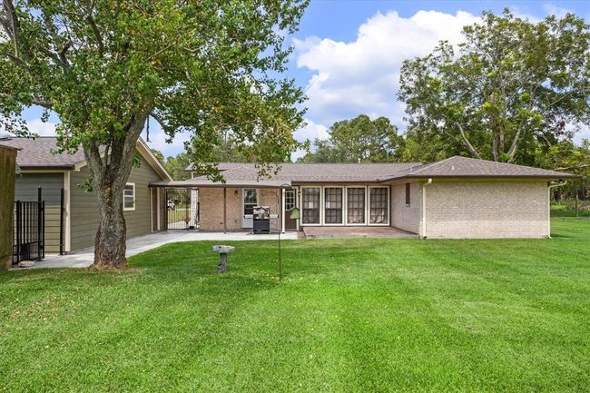 Plenty of room in the fully fenced backyard for your fur family and room for a pool | Image 34