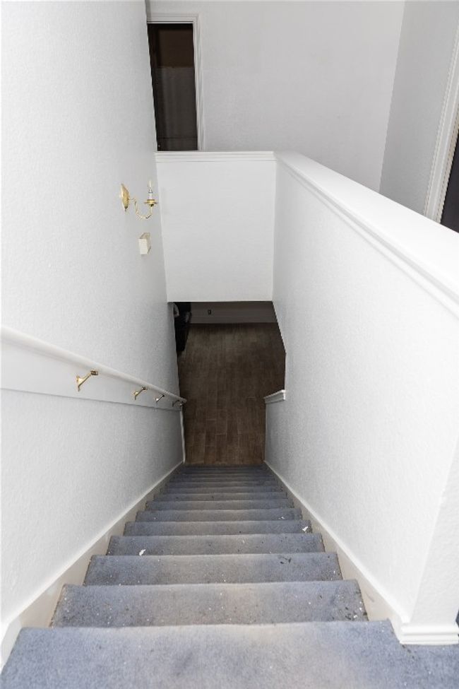 Stairs featuring a textured wall | Image 20