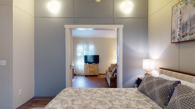 Bedroom with wood finished floors | Image 24