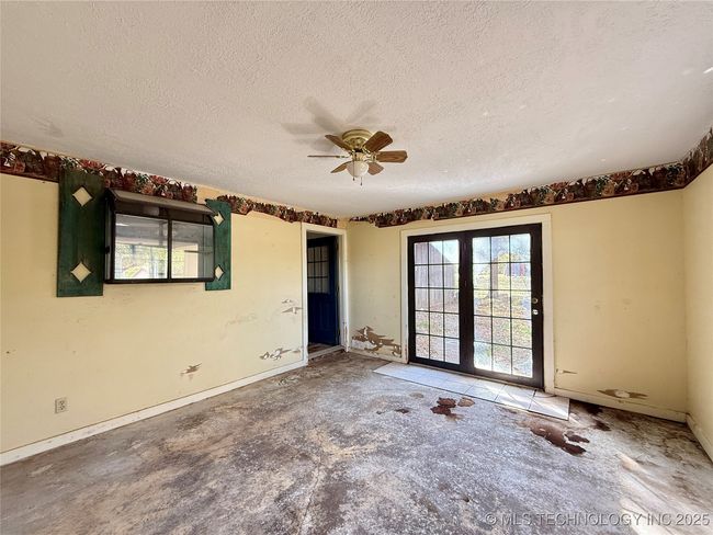 BONUS ROOM FROM THE KITCHEN THAT LOOKS LIKE IT WAS ONCE A PATIO AND HAS EXTERIOR DOORS | Image 10