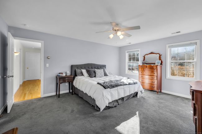 All bedrooms are found on the second floor. The master bedroom offers wall-to-wall carpet, ceiling fan, walk-in closet and remodeled full bath. | Image 17