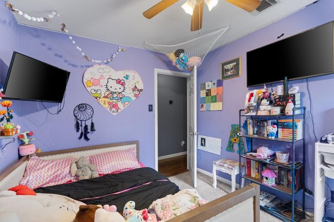 Bedroom featuring carpet, ceiling fan, and baseboards | Image 18