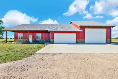 View of front of home featuring a garage and a front lawn | Image 1