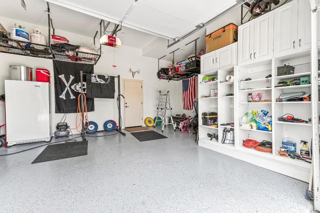 Garage featuring a garage door opener | Image 26