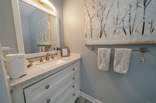 Updated half bath in foyer | Image 10