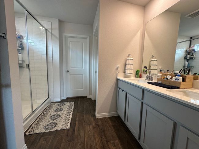Owner suite Bathroom with a double vanity and walk in shower | Image 7