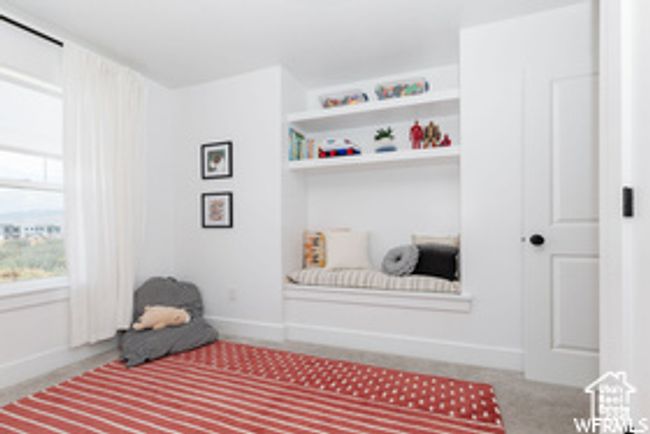 Sitting room with baseboards and carpet floors | Image 7