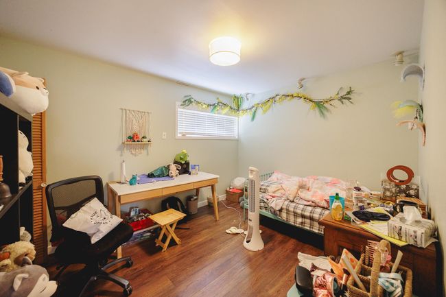 Bedroom featuring wood finished floors | Image 30
