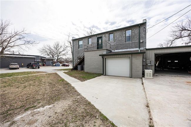 View of front of house with driveway and an attached garage | Image 61