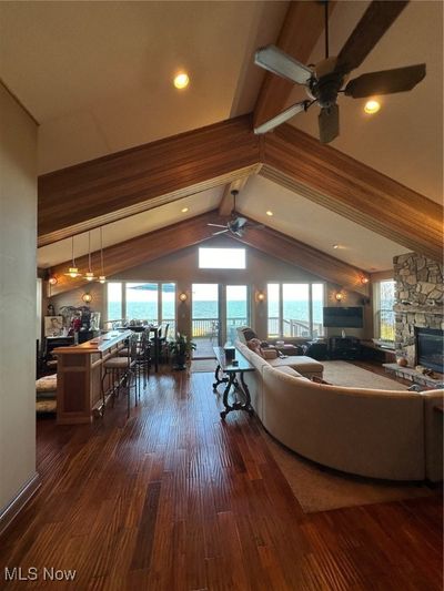 Great room with radiant in floor heated real Teak wood floor | Image 2