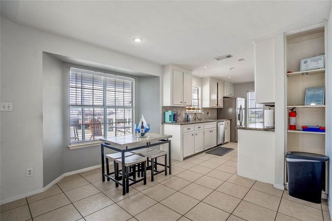 Dining area with plenty of room for a small table and chairs. | Image 7