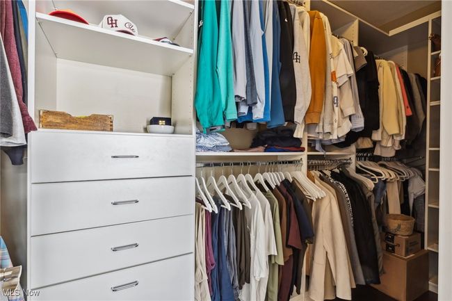 Large walk-in closet with built-in shelving and drawers | Image 23