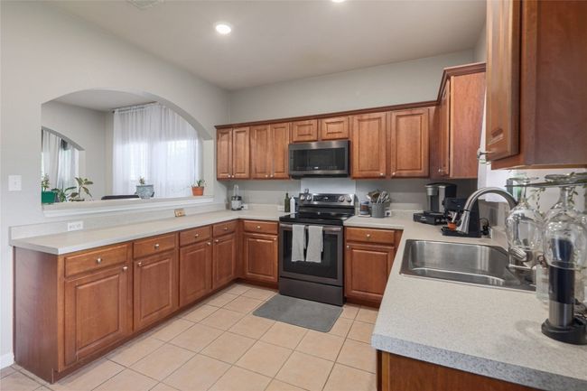 Amazing kitchen with lots of cabinets and countertops | Image 8