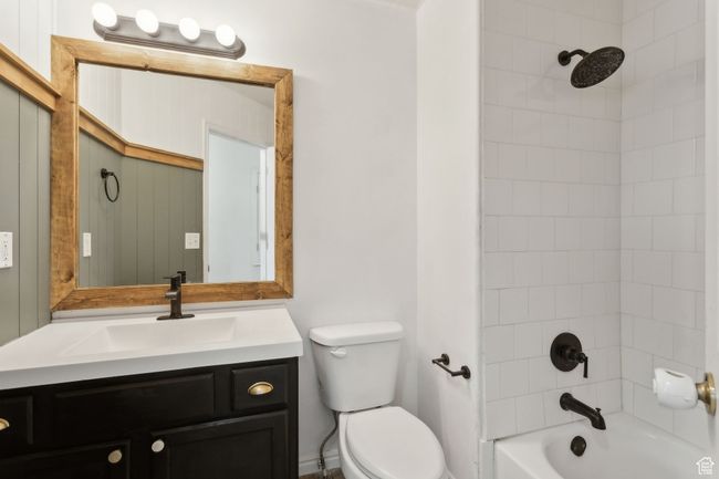 Full bath with toilet, vanity, and bathtub / shower combination | Image 12