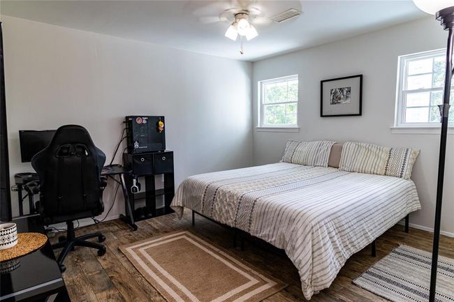 Upstairs bedroom (second of three upstairs). Windows face toward the rear of the home. | Image 23