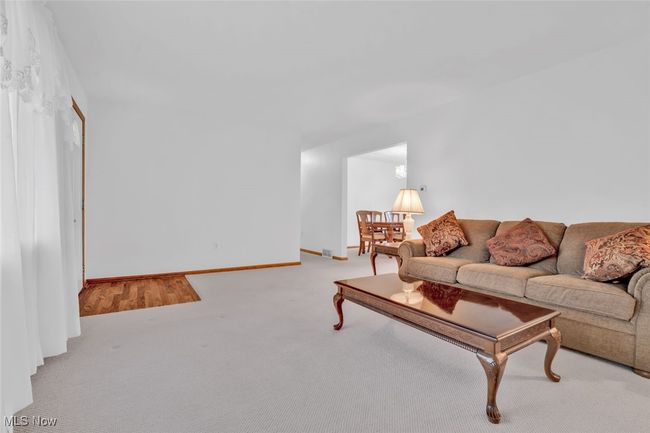 Carpeted living room featuring baseboards | Image 9