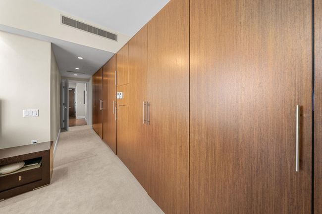 Corridor with light colored carpet and recessed lighting | Image 17