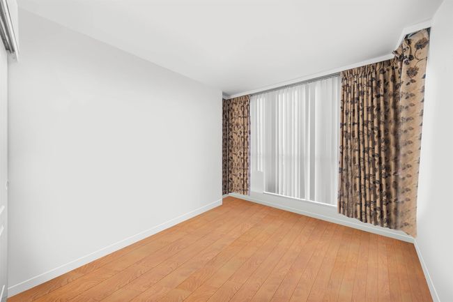 Unfurnished room featuring baseboards and light wood-style flooring | Image 6