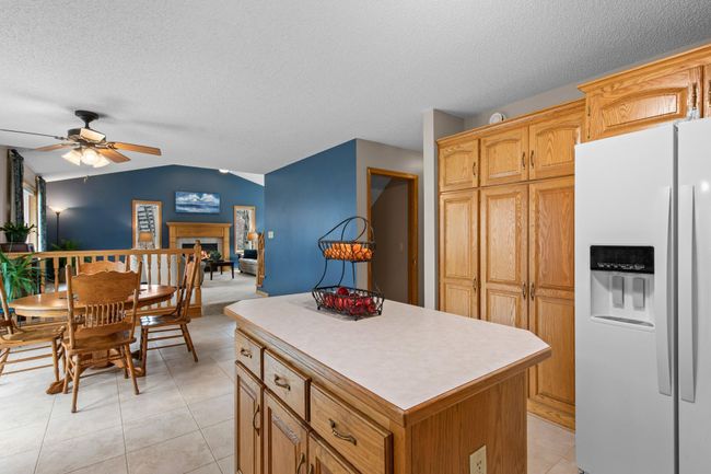 Kitchen is open to dining and living areas | Image 11