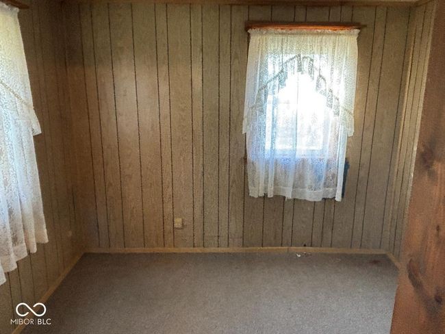 empty room with wooden walls | Image 12
