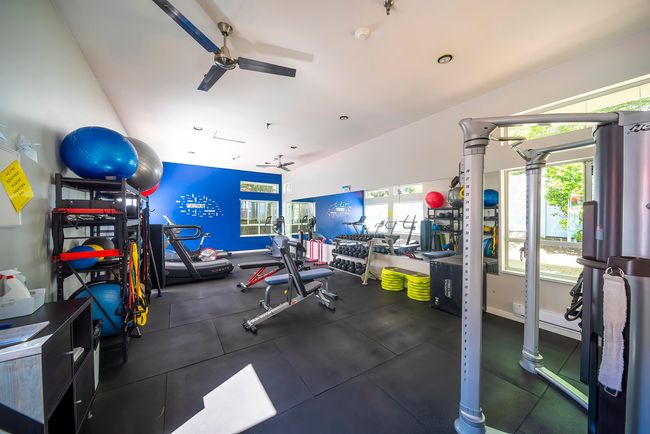 Workout area featuring ceiling fan | Image 7