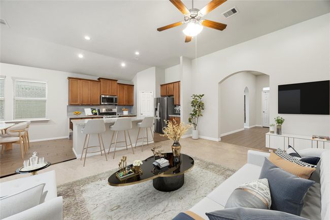 Unwind in this inviting living room that blends comfort and function, with an open layout connecting directly to the kitchen, perfect for gatherings. *Virtually Staged | Image 7