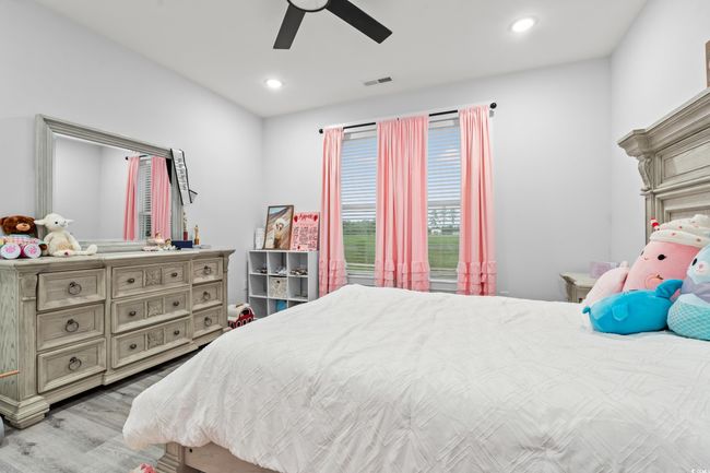 Bedroom featuring wood finished floors, recessed lighting, and ceiling fan | Image 25