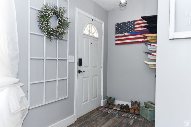 Foyer with wood finished floors and baseboards | Image 8