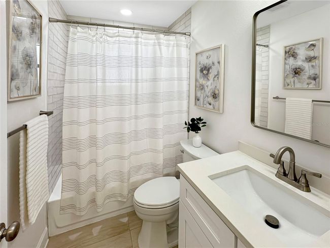 Guest Bathroom – Full View with Shower, Sink & Toilet | Image 30