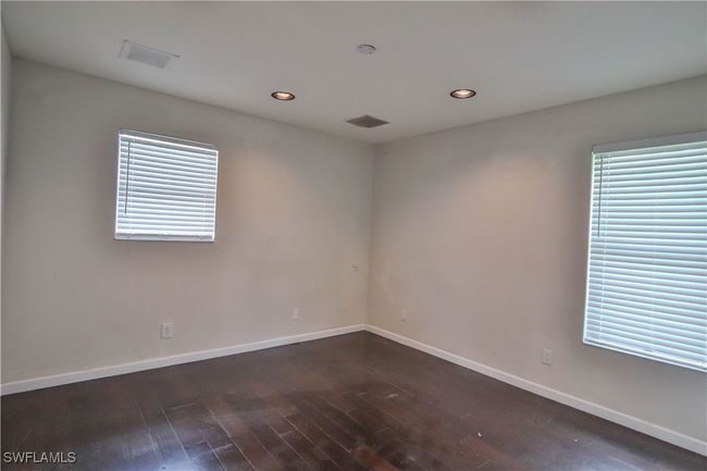 Unfurnished room with dark wood-type flooring, recessed lighting, and baseboards | Image 29