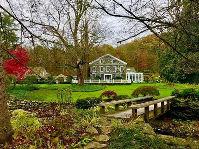 House view from across the brook in Fall | Image 1