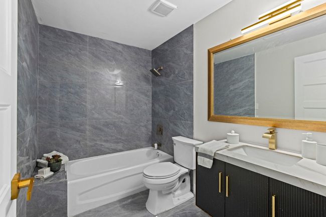 Full bath with visible vents, toilet, shower / bath combination, and vanity | Image 35