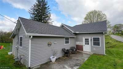 Rear view of property featuring a yard | Image 1