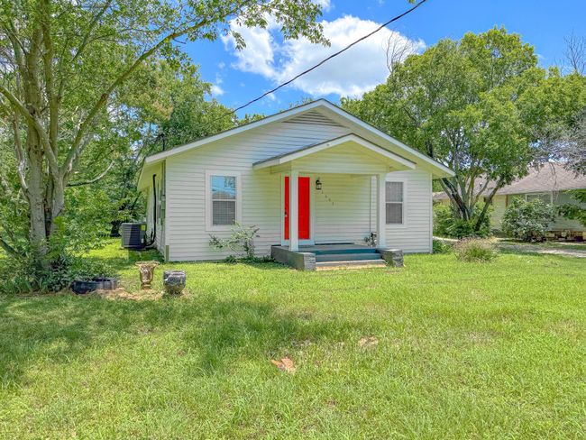 Bungalow featuring a front lawn and covered porch | Image 38