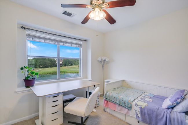 Bedroom featuring carpet floors and ceiling fan | Image 11