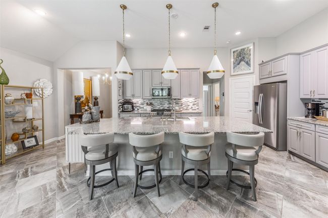This kitchen is equipped with state-of-the-art appliances from Whirlpool and LG, all of which have been replaced within the past year, ensuring the latest in functionality and style. | Image 4