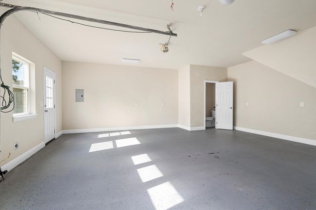 The detached garage has a half bath (not counted in property bath count) and has a 220V outlet. | Image 36